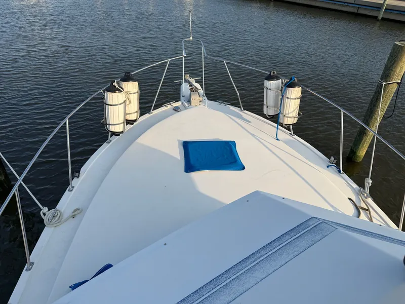 Slide: The Image of Bow of a 1989 Carver 320 Voyager boat on water. - 5