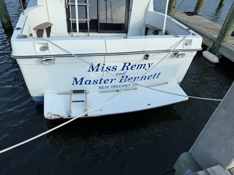 Slide: The Image of Rear view of 1989 Carver 320 Voyager yacht docked at marina. - 7