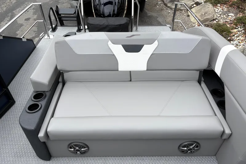 Slide: The Image of Luxurious seating on 2026 Evotti 525CS boat with cup holders and speakers. - 10