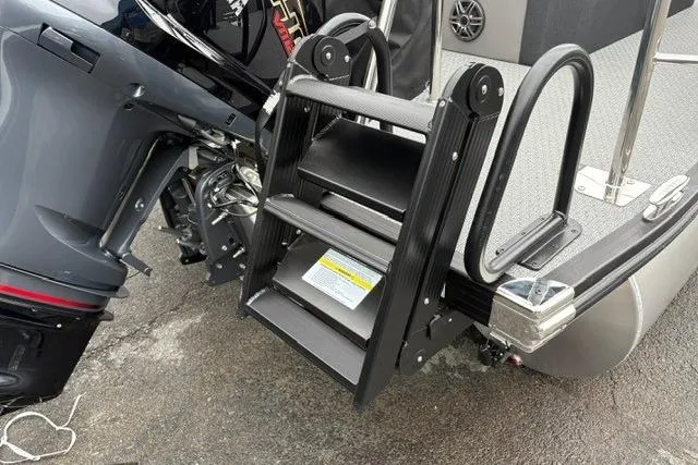 Slide: The Image of Evotti 525CS 2026 boat with a foldable boarding ladder and outboard motor. - 17