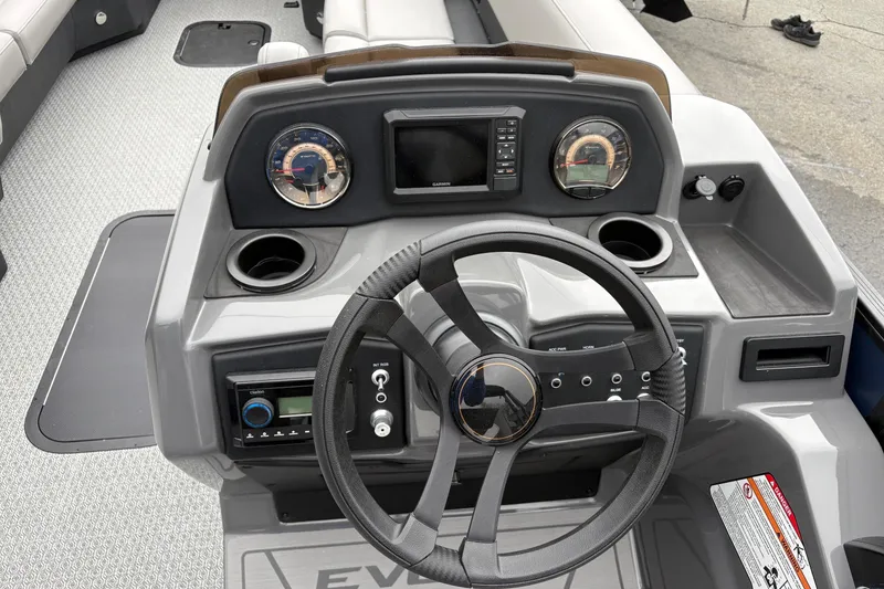 Slide: The Image of Steering console of 2026 Evotti 525CS boat with modern controls and gauges. - 3