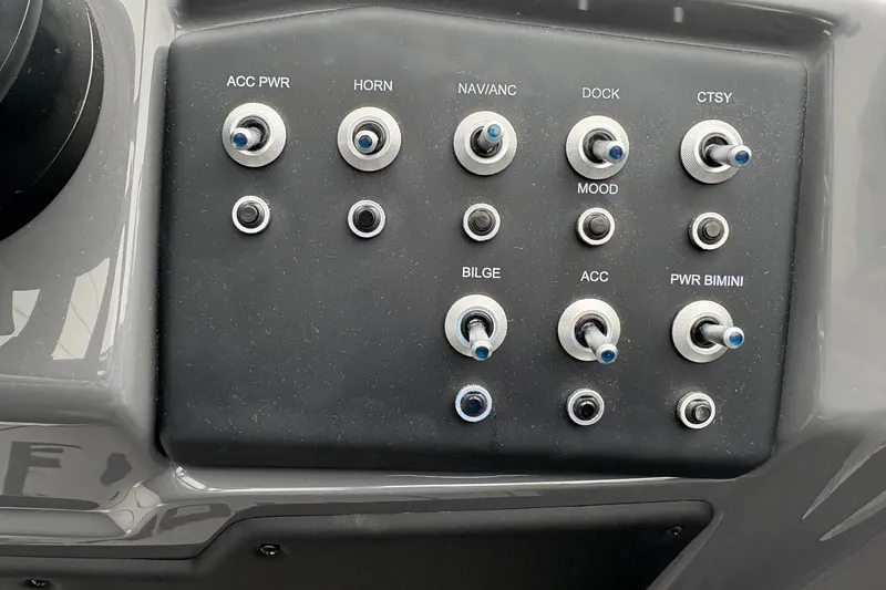 Slide: The Image of Control panel of 2026 Evotti 525CS boat with labeled switches. - 4