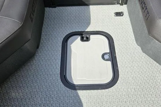 Slide: The Image of Interior view of 2026 Evotti 723QL boat with a floor hatch and textured carpet. - 8