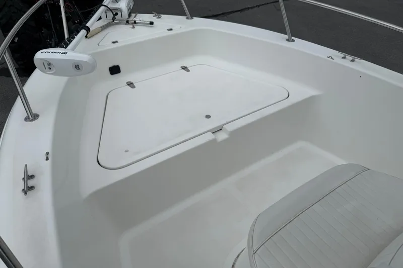 Slide: The Image of 2005 Sea Pro 190 Center Console boat interior with storage compartment and seating. - 15