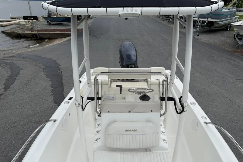 Slide: The Image of 2005 Sea Pro 190 Center Console boat at dock, featuring steering console and seating. - 18