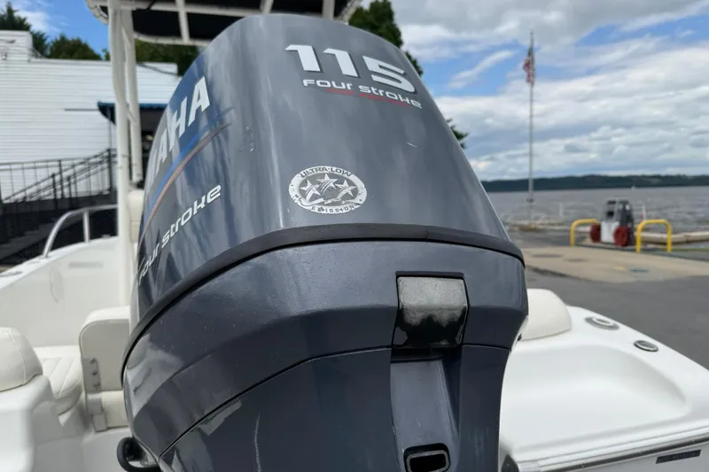Slide: The Image of 2005 Sea Pro 190 Center Console with Yamaha 115 four-stroke engine by the waterfront. - 3