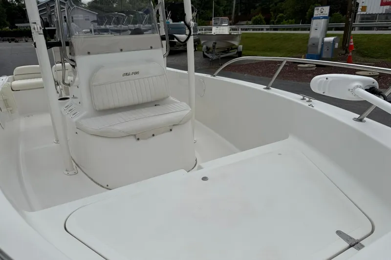 Slide: The Image of 2005 Sea Pro 190 Center Console boat interior with seating and steering console. - 7