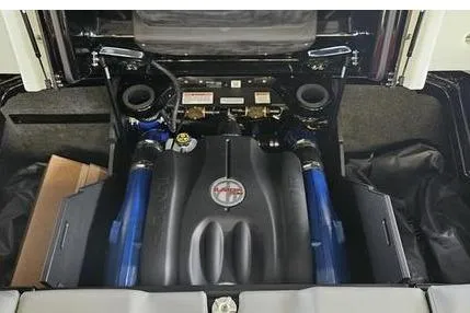 Slide: The Image of 2025 MasterCraft X22 engine compartment with advanced components and sleek design. - 12