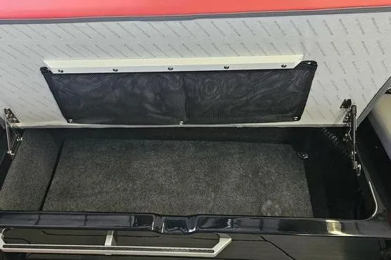 Slide: The Image of Storage compartment of 2025 MasterCraft X22 boat with black mesh pocket. - 13