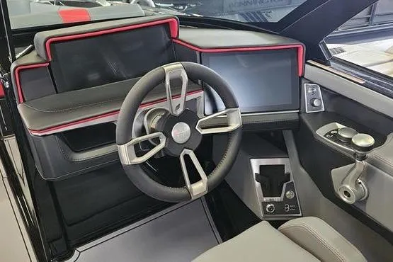 Slide: The Image of 2025 MasterCraft X22 boat dashboard with modern steering wheel and digital displays. - 3