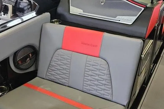 Slide: The Image of 2025 MasterCraft X22 boat interior with gray and red seating, featuring modern design elements. - 6