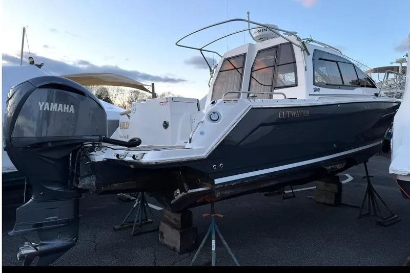 Slide: The Image of 2022 Cutwater C-24 Coupe boat with Yamaha outboard motor. - 11