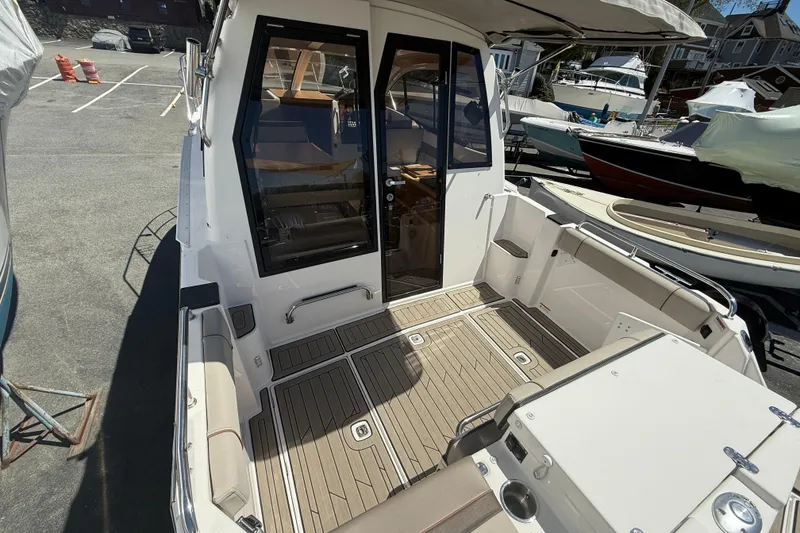 Slide: The Image of 2022 Cutwater C-24 Coupe boat with spacious deck and modern design. - 16