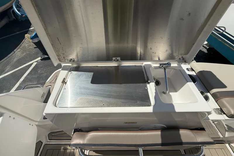 Slide: The Image of 2022 Cutwater C-24 Coupe boat sink and prep area with stainless steel finish. - 18