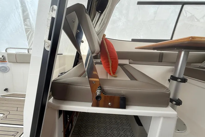 Slide: The Image of Interior of 2022 Cutwater C-24 Coupe with seating and table setup. - 27