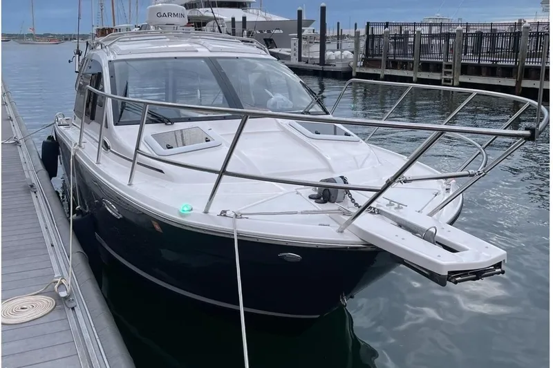 Slide: The Image of 2022 Cutwater C-24 Coupe at dock, sleek design. - 3