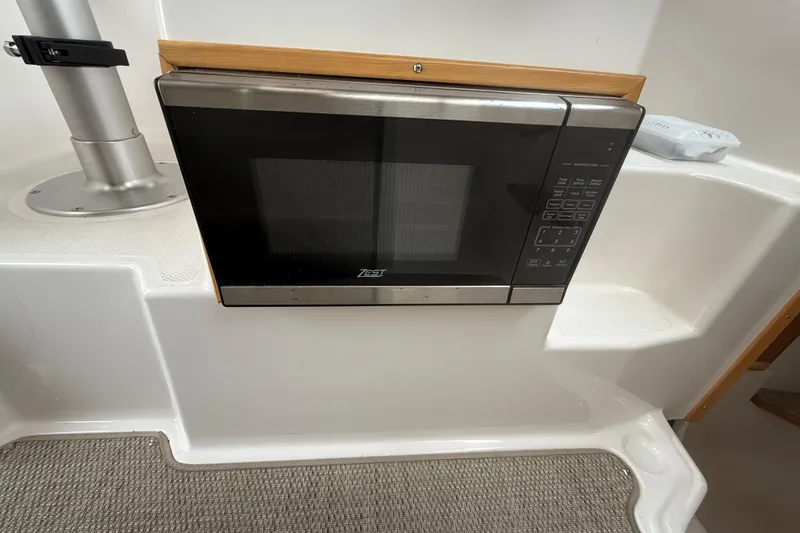 Slide: The Image of Microwave installed in 2022 Cutwater C-24 Coupe boat interior. - 32