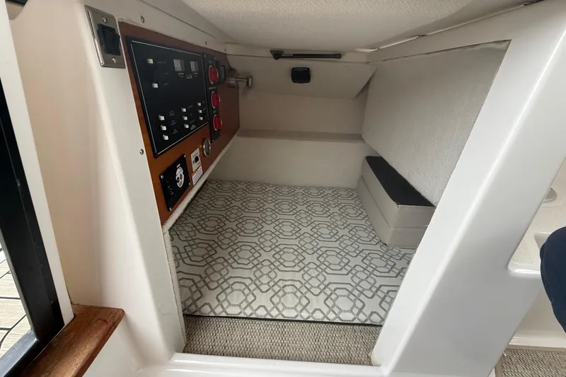 Slide: The Image of 2022 Cutwater C-24 Coupe interior cabin with control panel and patterned flooring. - 33