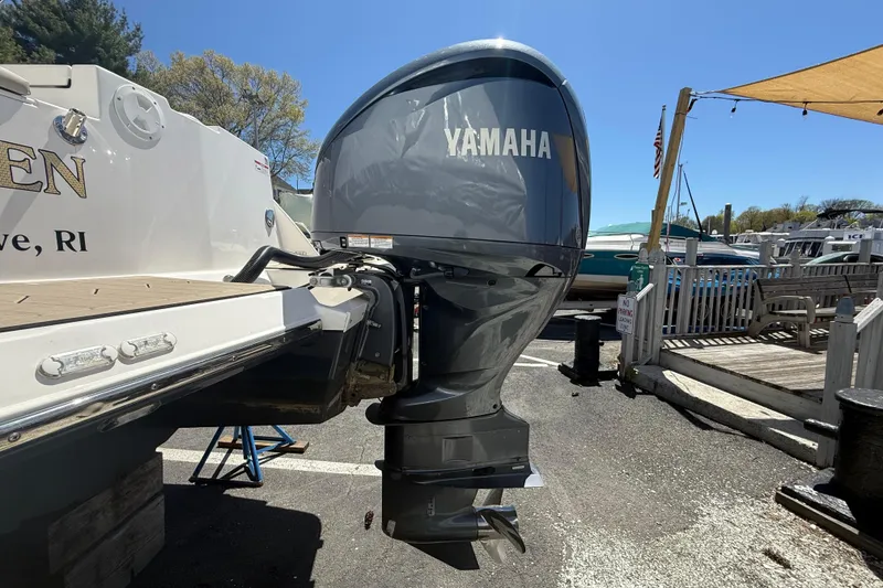 Slide: The Image of 2022 Cutwater C-24 Coupe with Yamaha outboard motor at a marina. - 59
