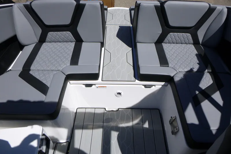 Slide: The Image of 2026 Yamaha Boats 222XD interior seating with modern gray and black upholstery design. - 14