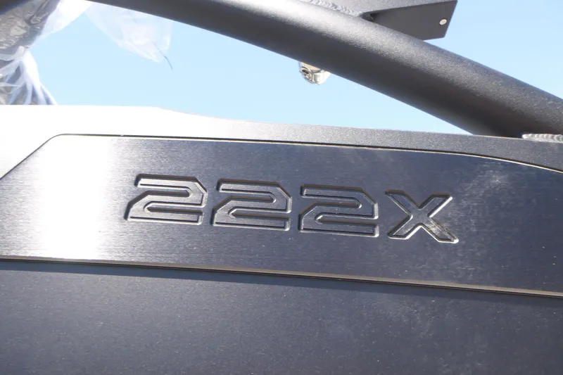 Slide: The Image of Close-up of 2026 Yamaha Boats 222XD model emblem on sleek metallic surface. - 19