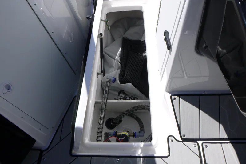 Slide: The Image of Storage compartment of 2026 Yamaha Boats 222XD, showcasing interior components and equipment. - 9