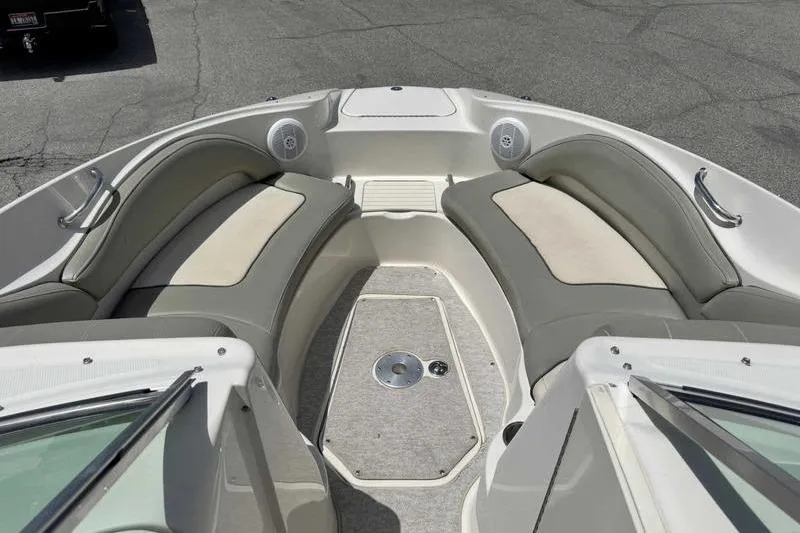 Slide: The Image of Interior view of 2005 Sea Ray 220 Sundeck boat with cushioned seating. - 11
