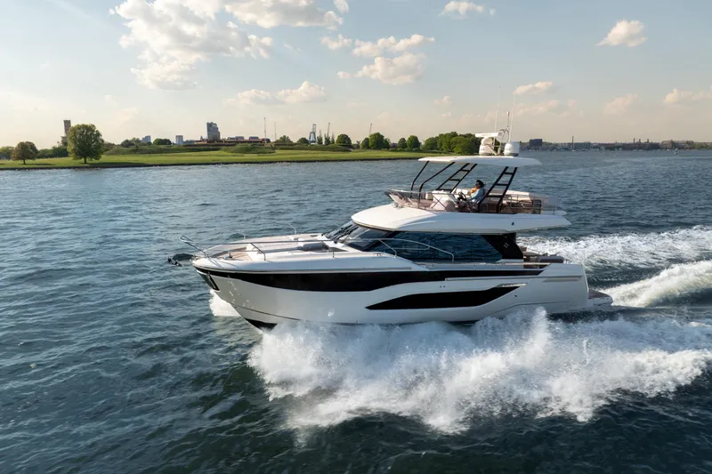 Slide: The Image of Luxury Prestige F4.9 yacht cruising on a sunny day, 2025 model. - 10