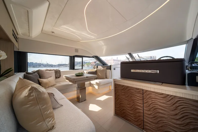Slide: The Image of Luxurious interior of 2025 Prestige F4.9 yacht with elegant seating and modern design. - 15