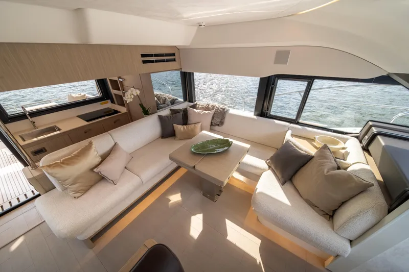 Slide: The Image of Luxurious 2025 Prestige F4.9 yacht interior with elegant seating and panoramic windows. - 16