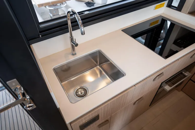 Slide: The Image of Modern kitchen sink and stovetop in 2025 Prestige F4.9 yacht. - 19