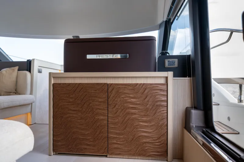 Slide: The Image of Interior of 2025 Prestige F4.9 yacht with elegant wood cabinetry and modern design. - 22
