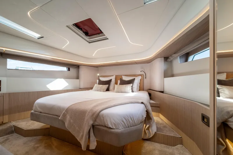 Slide: The Image of Luxurious bedroom interior of Prestige F4.9 yacht, 2025 model, featuring elegant design and ambient lighting. - 28