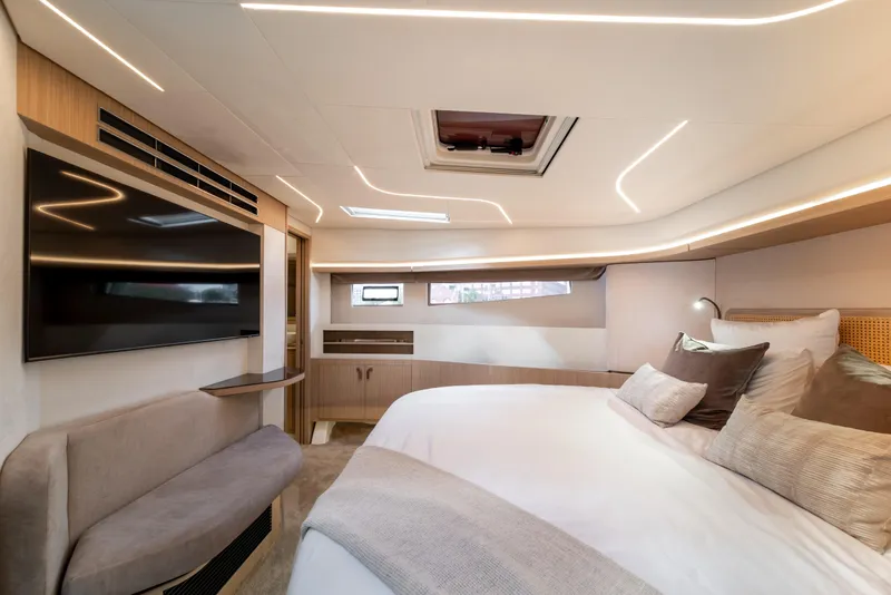 Slide: The Image of Luxurious 2025 Prestige F4.9 yacht bedroom with modern design and ambient lighting. - 29