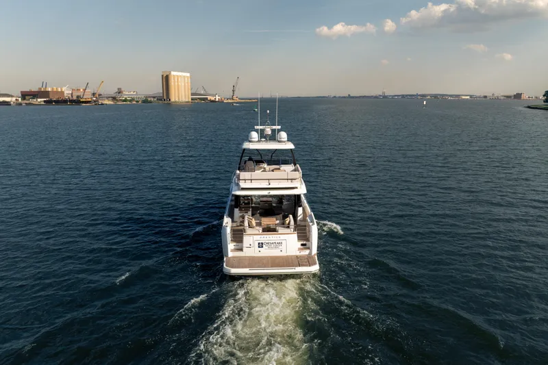 Slide: The Image of Luxury Prestige F4.9 yacht cruising on open water, 2025 model. - 3