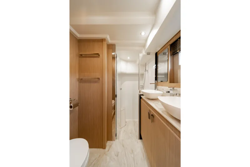 Slide: The Image of Luxurious bathroom interior of 2025 Prestige F4.9 yacht with modern fixtures and wood accents. - 31
