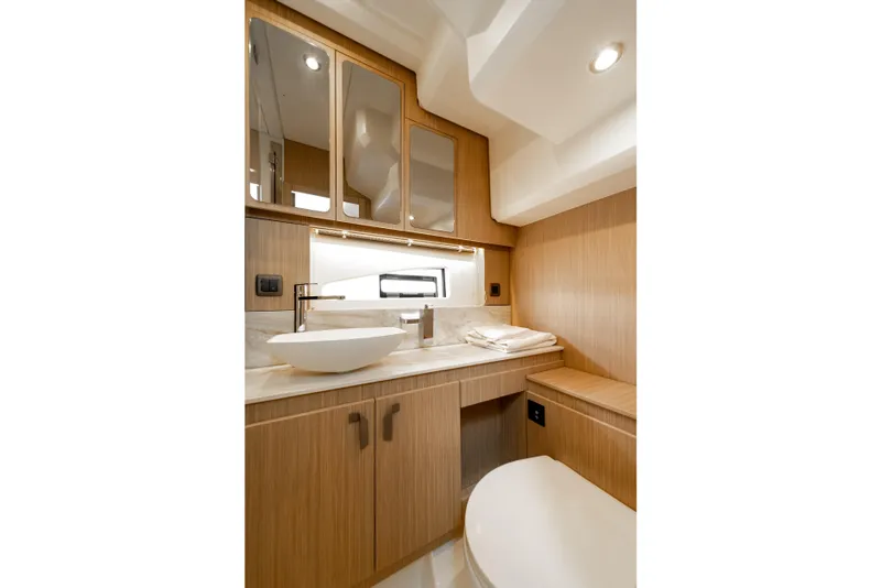 Slide: The Image of Luxurious bathroom interior of 2025 Prestige F4.9 yacht with modern fixtures and wood accents. - 37
