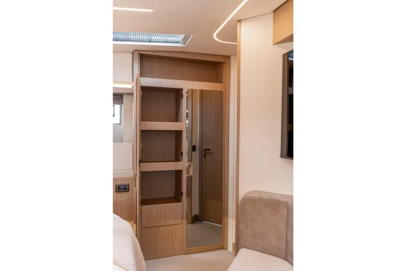 Slide: The Image of Modern interior of Prestige F4.9 yacht, featuring sleek wooden cabinetry, 2025 model. - 40