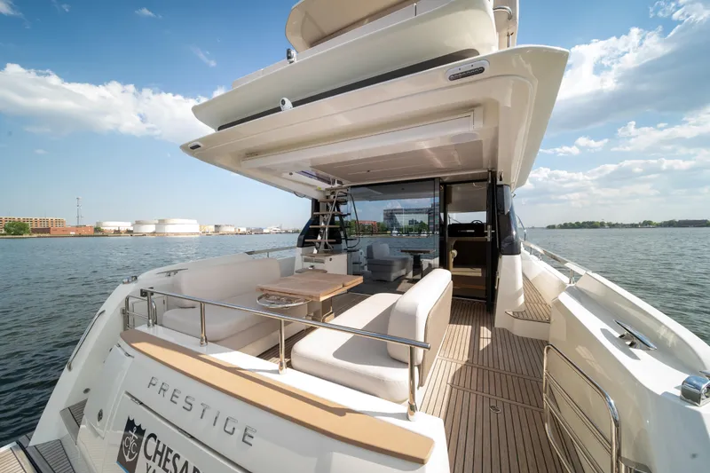 Slide: The Image of Luxury Prestige F4.9 yacht, 2025 model, featuring spacious deck and elegant seating on open water. - 45