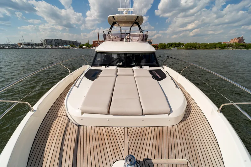Slide: The Image of Luxury Prestige F4.9 yacht deck, 2025 model, cruising on a sunny day. - 48