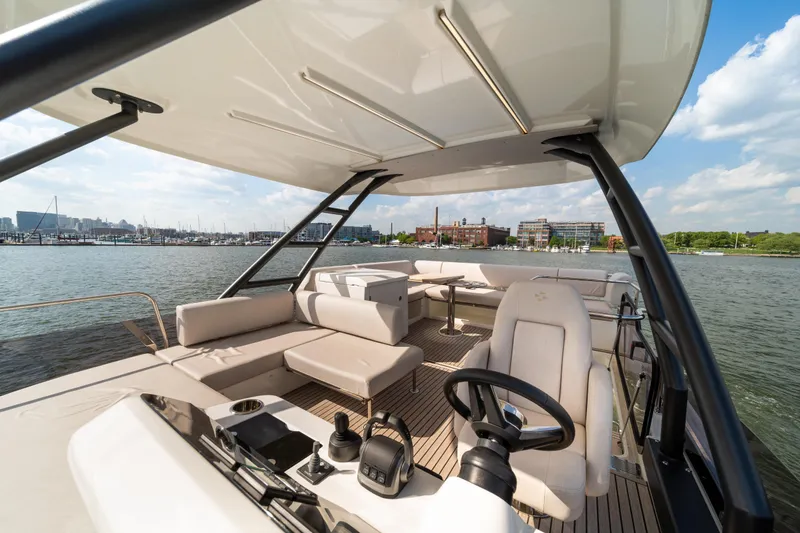 Slide: The Image of Luxurious 2025 Prestige F4.9 yacht interior with helm, seating, and waterfront view. - 51