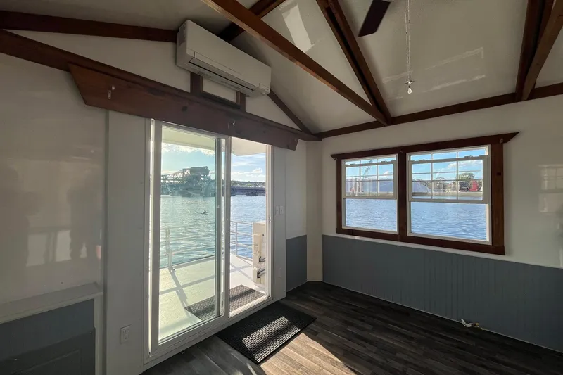 Slide: The Image of Interior of 2017 Catamaran Cruisers Aqualodge with waterfront view through large windows. - 13