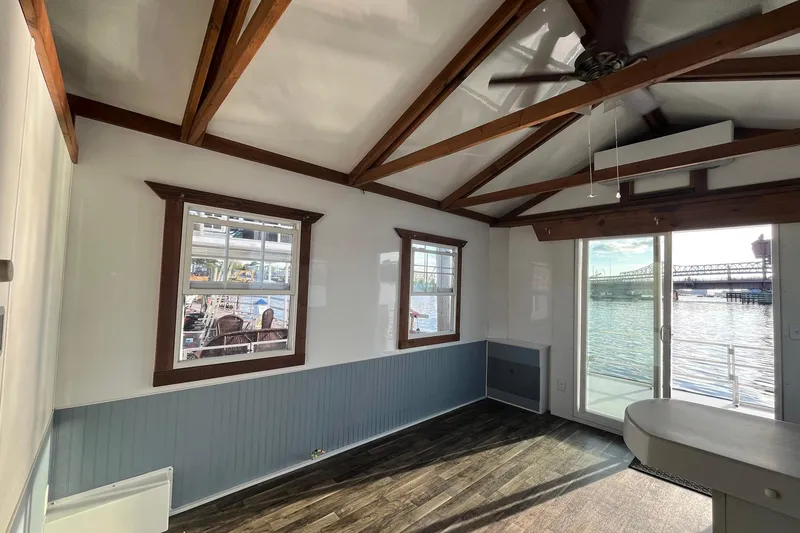 Slide: The Image of Interior of 2017 Catamaran Cruisers Aqualodge with waterfront view and wooden beams. - 17