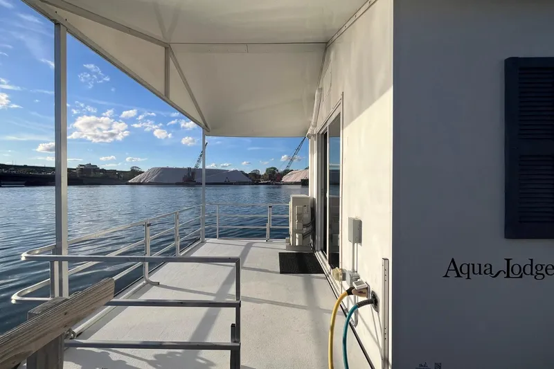 Slide: The Image of 2017 Catamaran Cruisers Aqualodge on water, featuring deck and scenic view. - 18