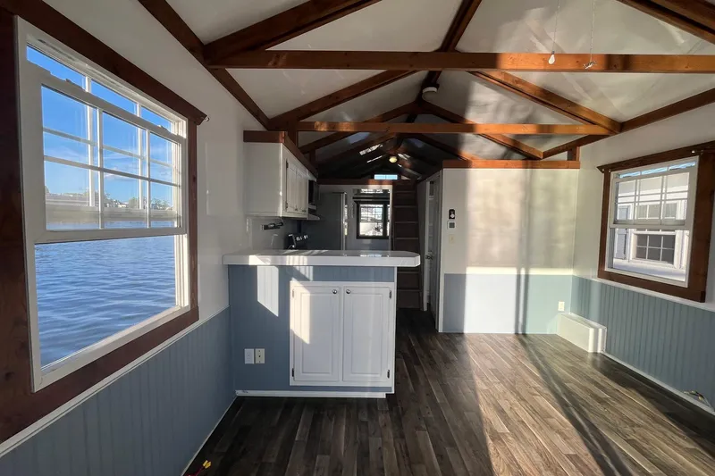 Slide: The Image of Interior of 2017 Catamaran Cruisers Aqualodge with wooden beams and waterfront view. - 21
