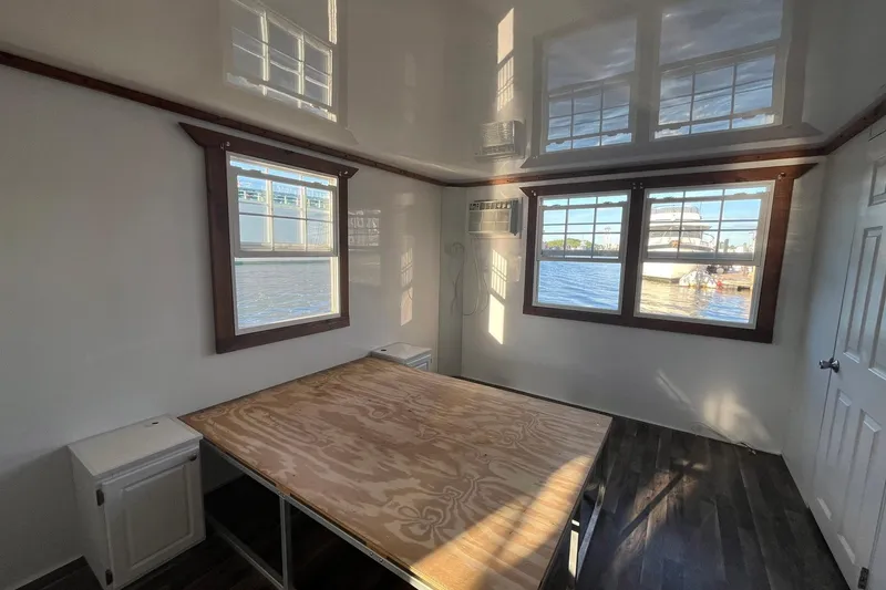 Slide: The Image of Interior of 2017 Catamaran Cruisers Aqualodge with waterfront view through large windows. - 22