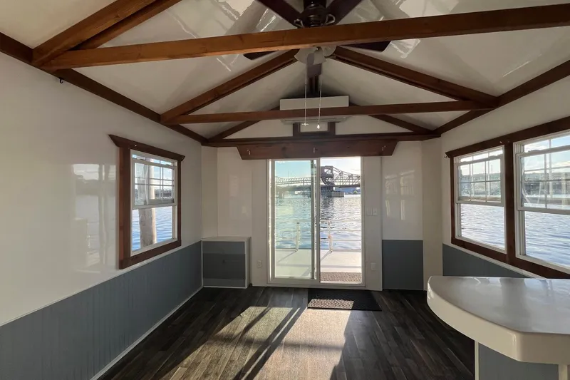 Slide: The Image of Interior of 2017 Catamaran Cruisers Aqualodge with waterfront view through large windows. - 26