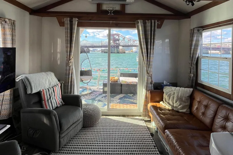 Slide: The Image of Interior of 2017 Catamaran Cruisers Aqualodge with cozy seating and waterfront view. - 3