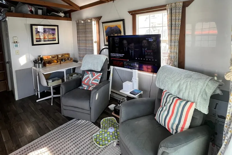 Slide: The Image of Interior of 2017 Catamaran Cruisers Aqualodge with cozy seating and wall-mounted TV. - 4