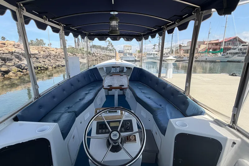 Slide: The Image of Interior view of a 1996 Duffy Classic 21 boat docked at a marina. - 14